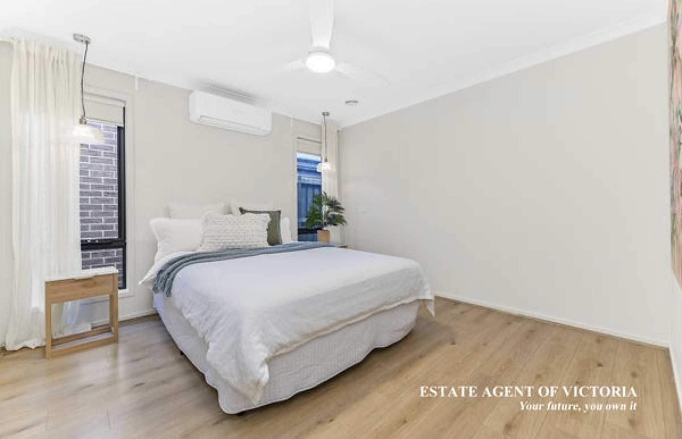 A bright bedroom at Clyde House with soft natural light