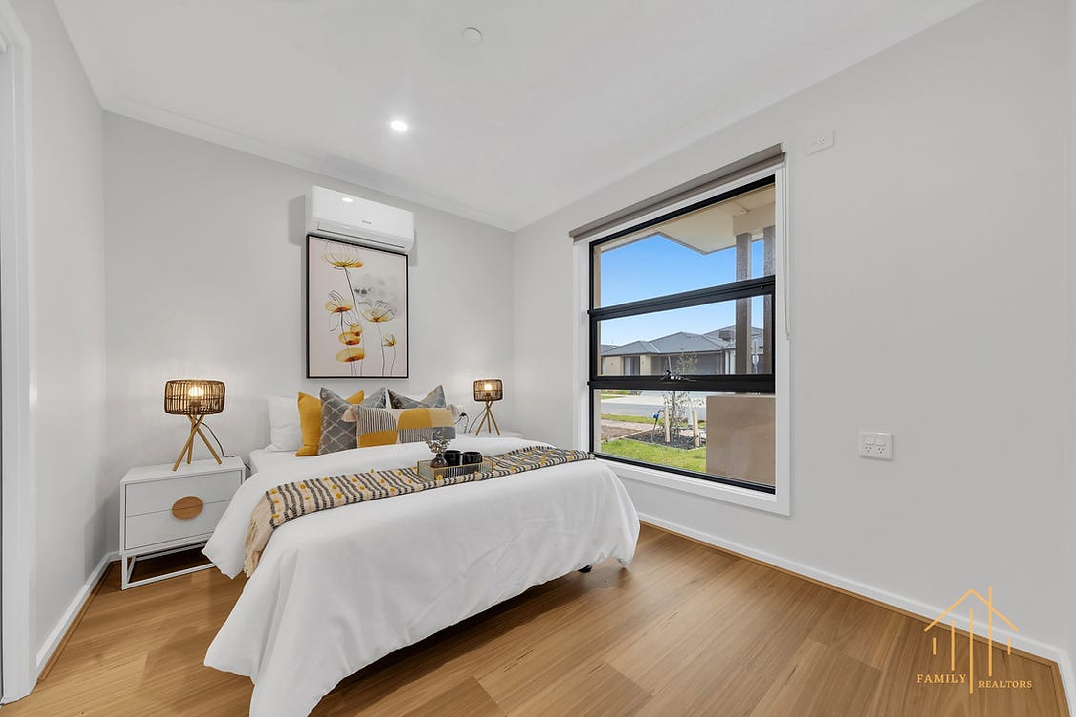 A bright bedroom at Gippsland House with timber floors