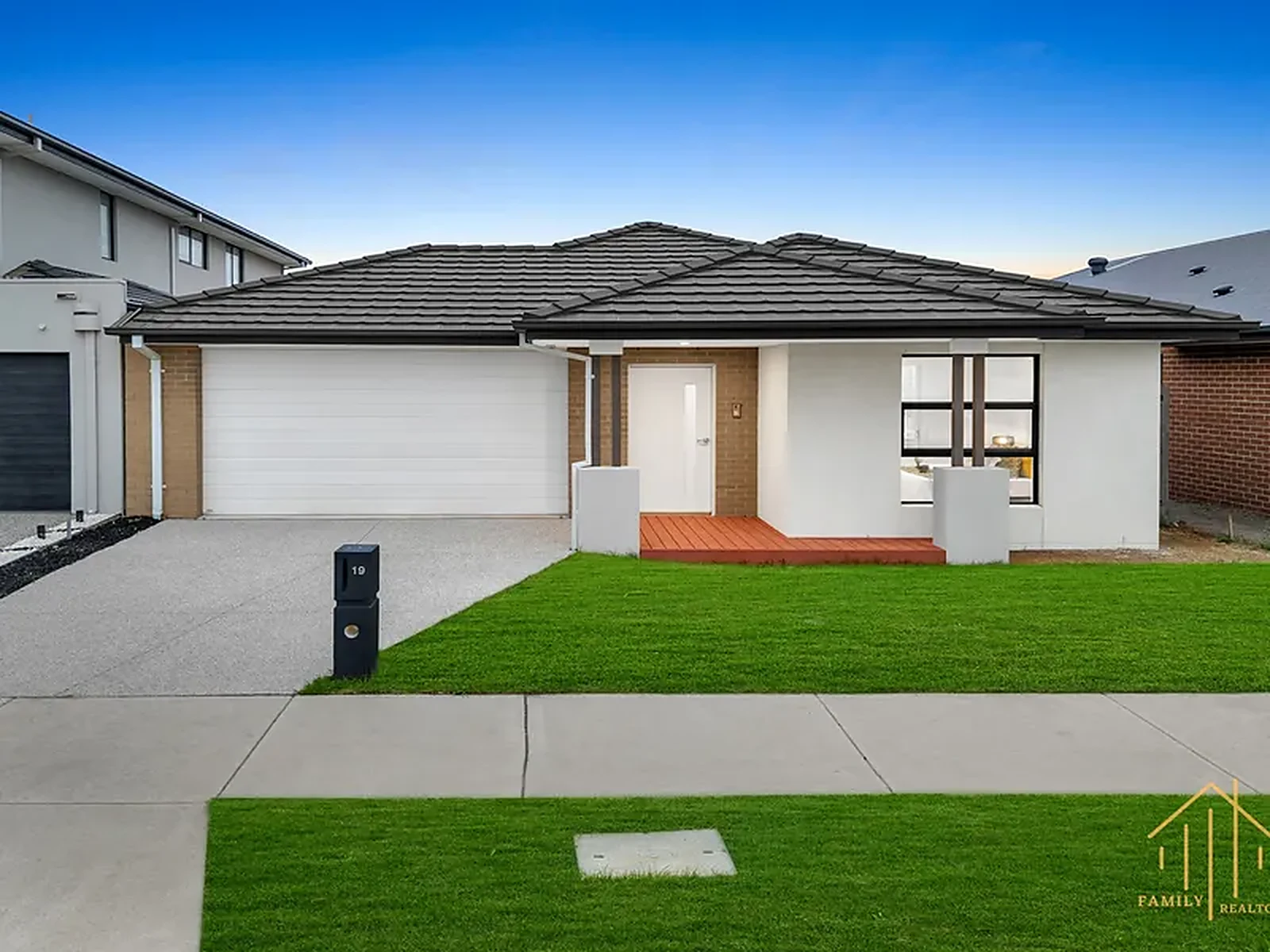 The front of Gippsland House with its garage and lawn