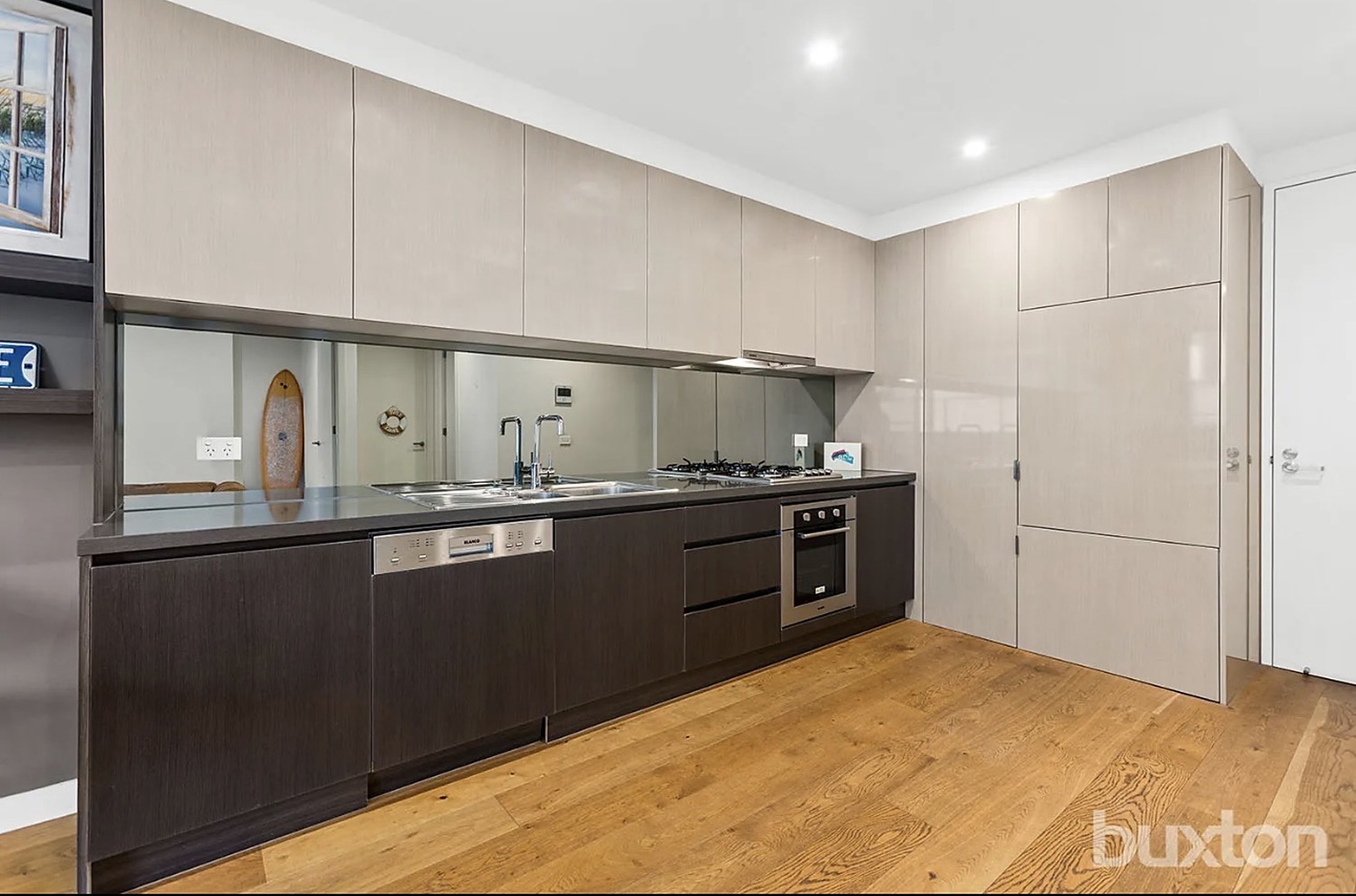 The modern kitchen at Mentone House with timber floors