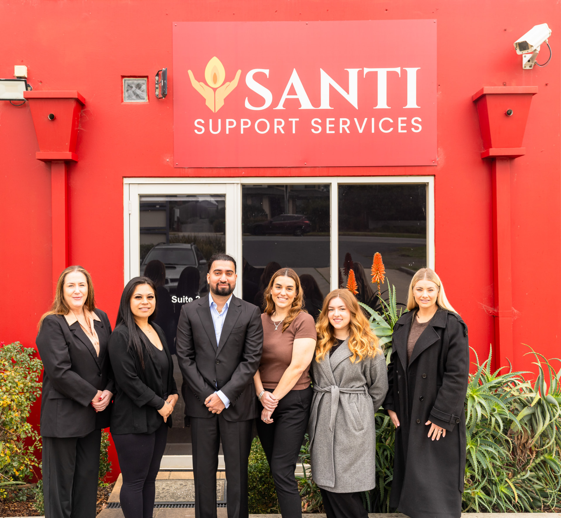 The Santi Support Services team outside their Langwarrin office
