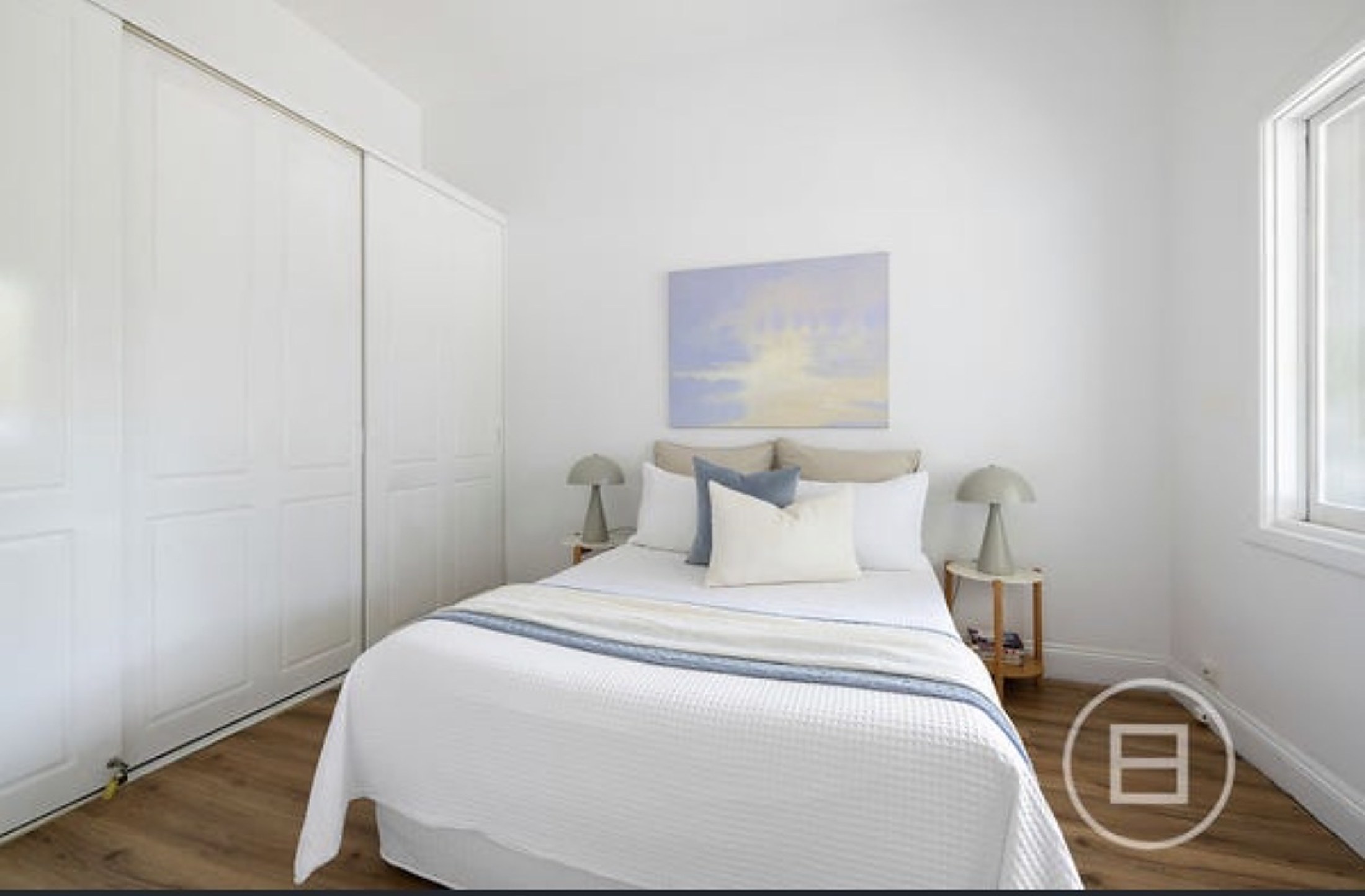 A calm bedroom at Port Melbourne House with soft natural light