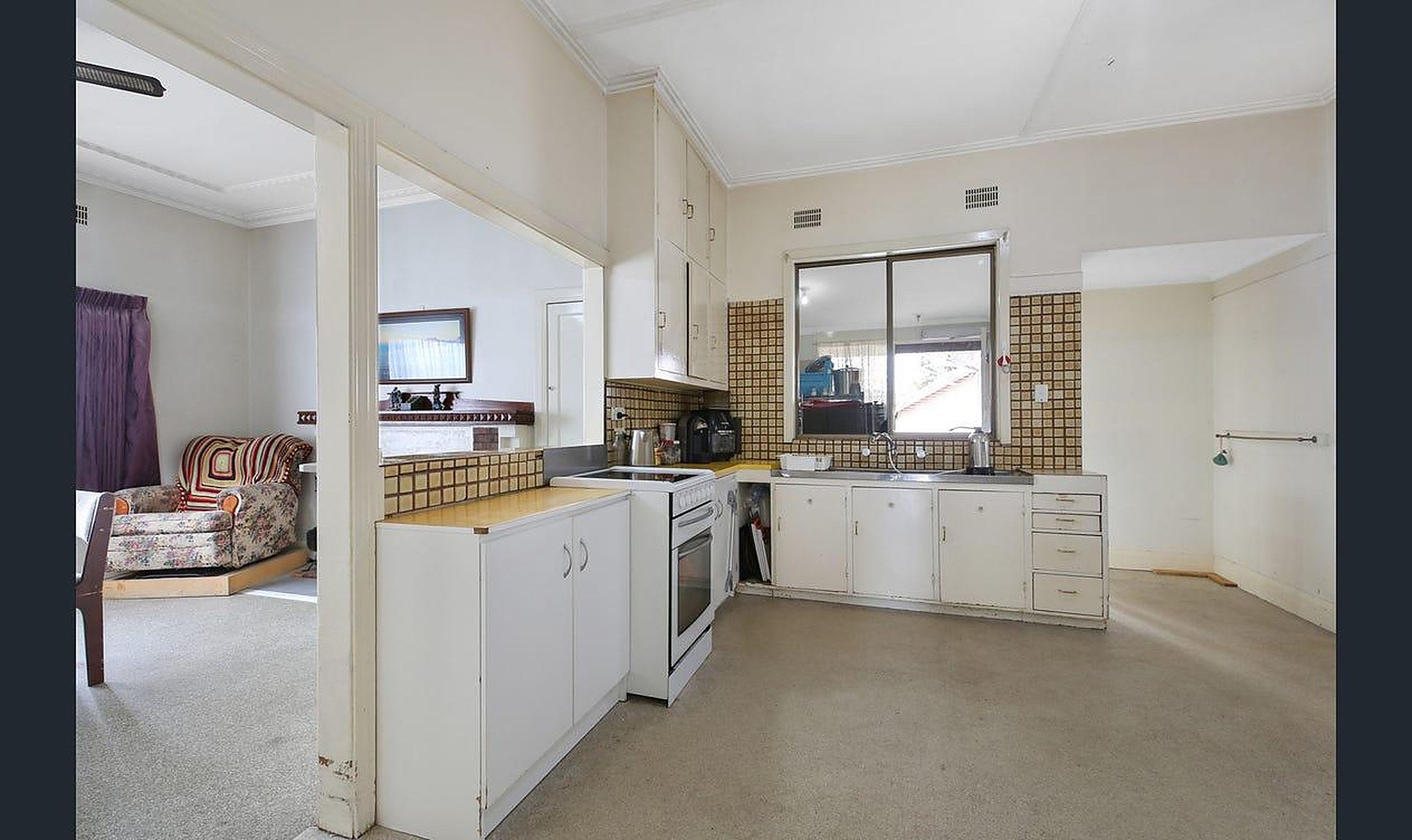 The kitchen at Warrigal House adjoining the living area